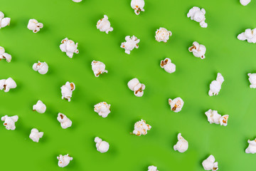 Popcorn pattern on green background. Top view.