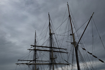 Sailboat Mast  and ropes with cloudy blue sky in the background