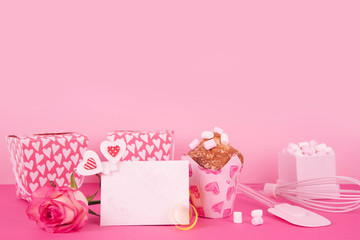 Muffins in colorful paper baking cup with red hearts.