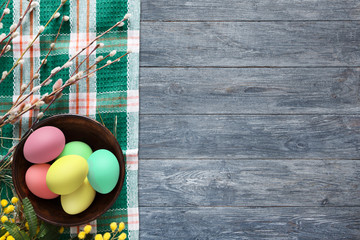 Colorful easter eggs on wood background