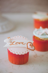 Yummy cupcakes. Valentine sweet love cupcake on table on light background