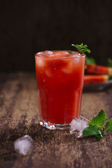 Refreshing summer watermelon juice in glasses with slices of watermelon