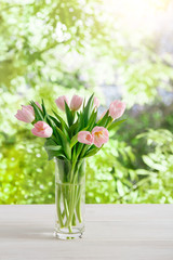 Flowers background, pink tulips at garden background, copy space