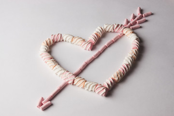 Romantic heart with arrow made from marshmallow