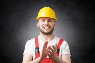 Construction worker clapping his hands