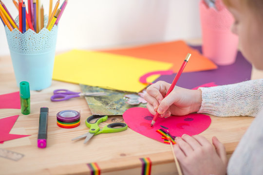 girl play with scissors and color paper
