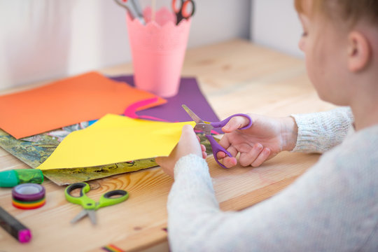 Child With Scissors Cut Paper
