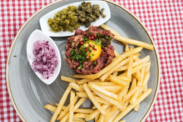 tasty Steak tartare (Raw beef) - classic steak tartare on white plate