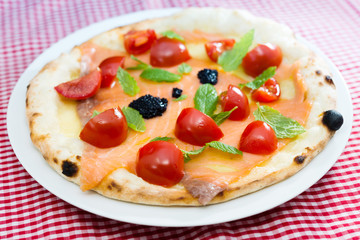 tasty salmon pizza on a the table