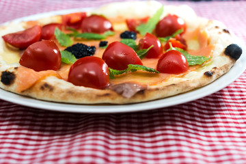 tasty salmon pizza on a the table