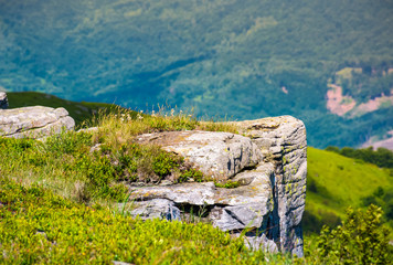 giant boulders on grassy slopes of Polonina Runa. beautiful summer scenery in Carpathian mountains with gorgeous cloudscape