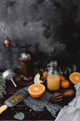 close up view of orange pieces and juice in bottle on wooden tabletop