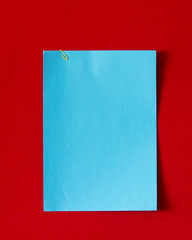 Blue paper on red frieze fabric
