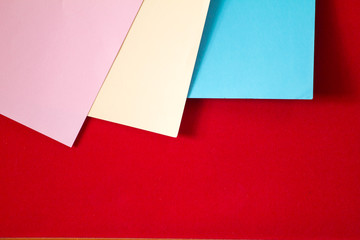 paper color on red frieze fabric