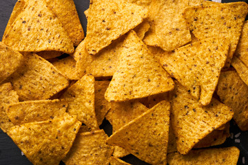 Triangular corn chips nachos background