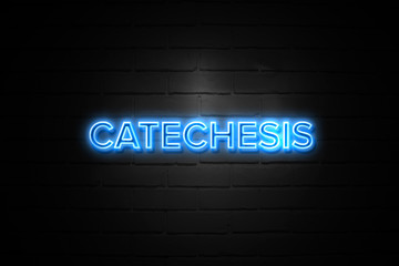 Catechesis neon Sign on brickwall