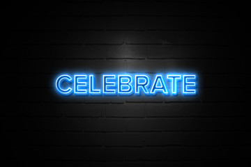 Celebrate neon Sign on brickwall