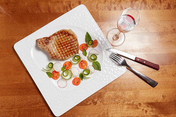 Fototapeta na wymiar Grilled meat fillet steak with vegetables on plate