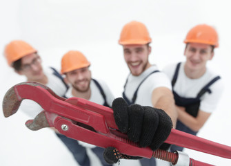 view from the top.group of builders showing a gas key.