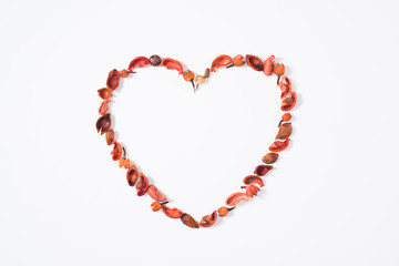 top view of heart from dried fruits isolated on white