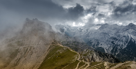Obere Karwendelspitze mountain top with storm cloud panoramic view, Germany