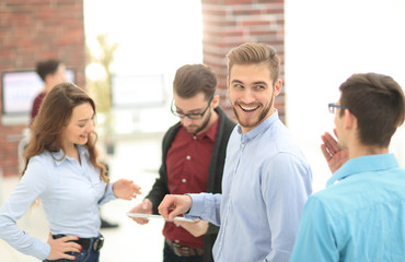 Fototapeta premium Manager consulting with his colleagues in the office.