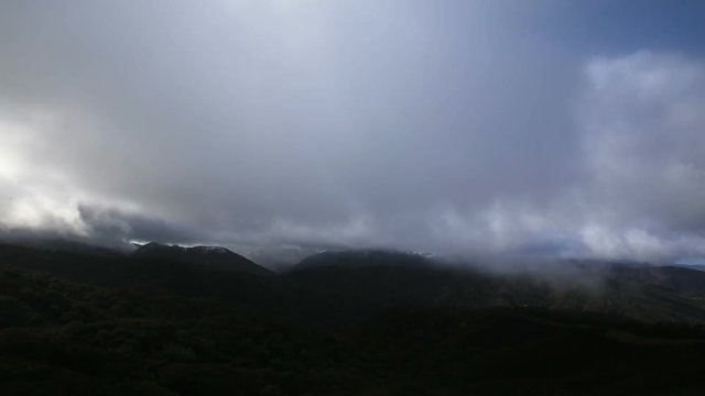 Winter storms darken the foreground in the mountains of Los Padres National Forest in California.