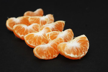 Tangerines, Peeled tangerine and Tangerine Slices on Black background Isolated.