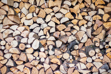 neatly stacked firewood, fuel in the cold winter, a pattern for creativity