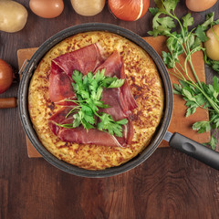 Spanish tortilla with ingredients and copy space