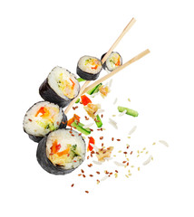 Sushi pieces with chopsticks frozen in the air isolated on white background