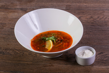 Solyanka soup with lemon