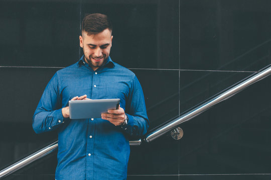 Young Handsome Man Using Digital Tablet Outdoors