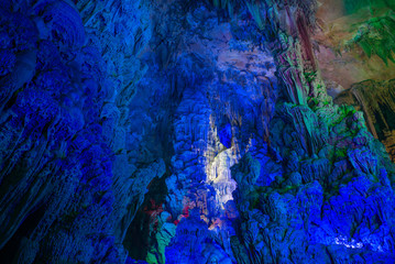 Fototapeta na wymiar Illumination of underground caves with lakes in Guilin City, Guangxi Province, People's Republic of China