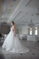 Fototapeta premium Beautiful bride in wedding dress before wedding ceremony