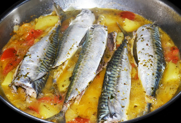 fresh cooked fish with vegetables and potatoes - greek food