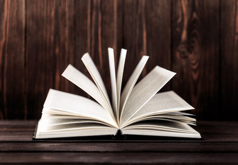 Old books on wooden background. The source of information. Books indoor. Home library. Knowledge is power