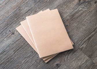 Blank book mock up, catalog, magazines or note cover template with recycle brown paper texture on table floor