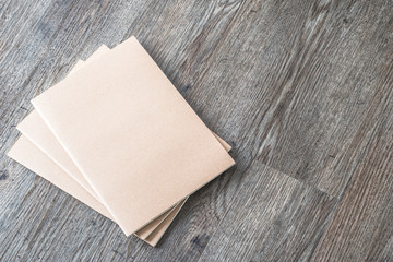 Blank book mock up, catalog, magazines or note cover template with recycle brown paper texture on table floor