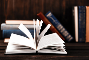 Old books on wooden background. The source of information. Books indoor. Home library. Knowledge is power