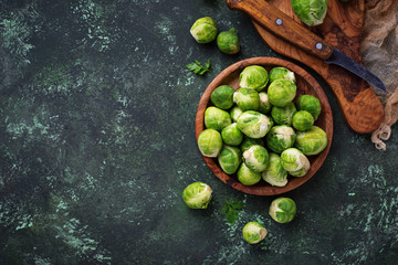 Brussels sprouts on green concrete background