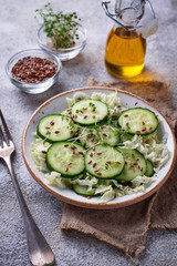 Healthy spring salad with cucumber, flax seed and cress 
