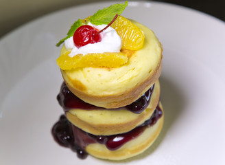 fritter dessert with cream and jam..