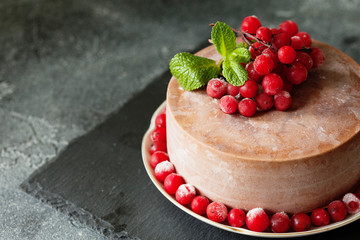 Chocolate mousse cake with lingonberry fruits and mint copy space
