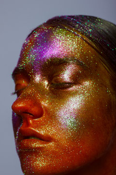 Creative make-up of colored powder closeup. orange pigment, shadows, paints