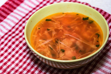 Borscht or Russian red vegetable soup in bowl