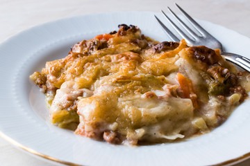Portion of Vetegables Gratin with Minced Meat and Cheese.