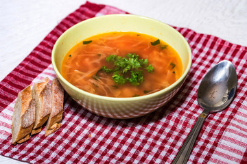 Borscht or Russian red vegetable soup in bowl