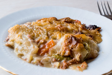 Portion of Vetegables Gratin with Minced Meat and Cheese.