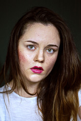 portrait of young woman with freckles